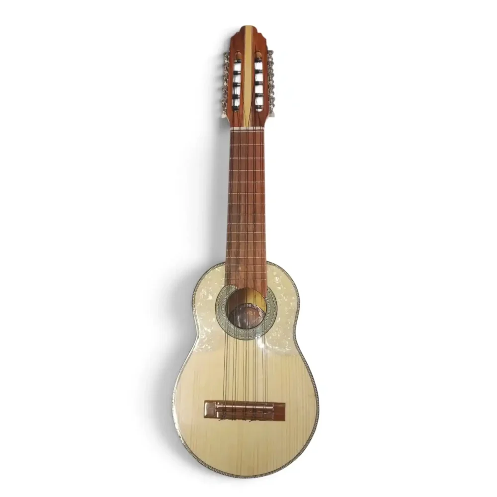 Cream-colored acoustic guitar photographed upright, showing long wooden neck, fretboard, and ornate soundhole rosette