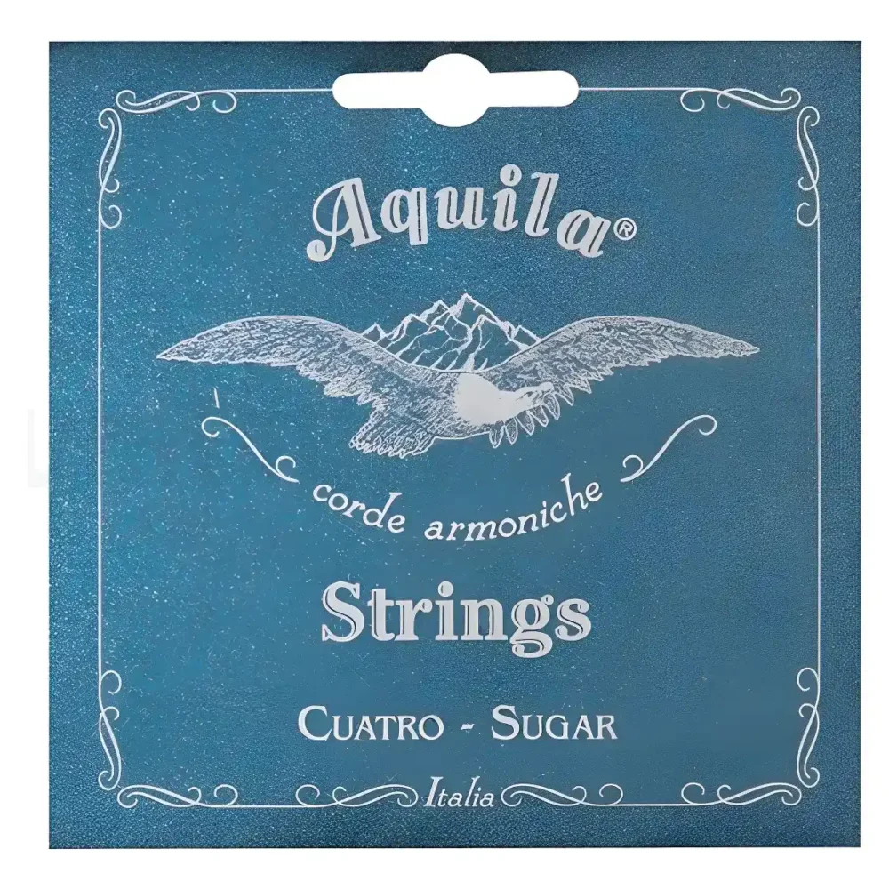 Label for Aquila strings product: a blue, vintage-style card with a white dove and mountains, decorative border, and the text 'Aquila', 'corde armoniche', 'Strings', 'Cuatro - Sugar', 'Italia'